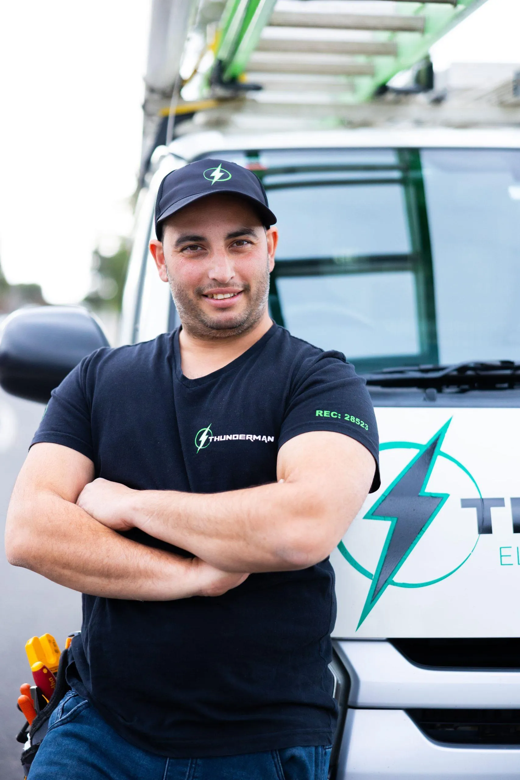 Yiannis Knodarites, licensed Melbourne electrician, in front of the Thunderman van